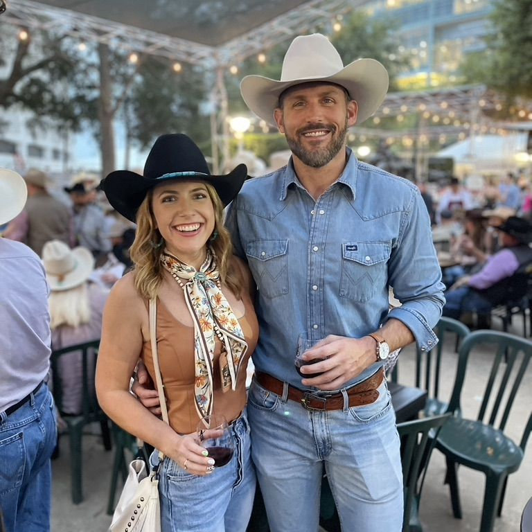 Rachelle and Clayton seated together outdoors