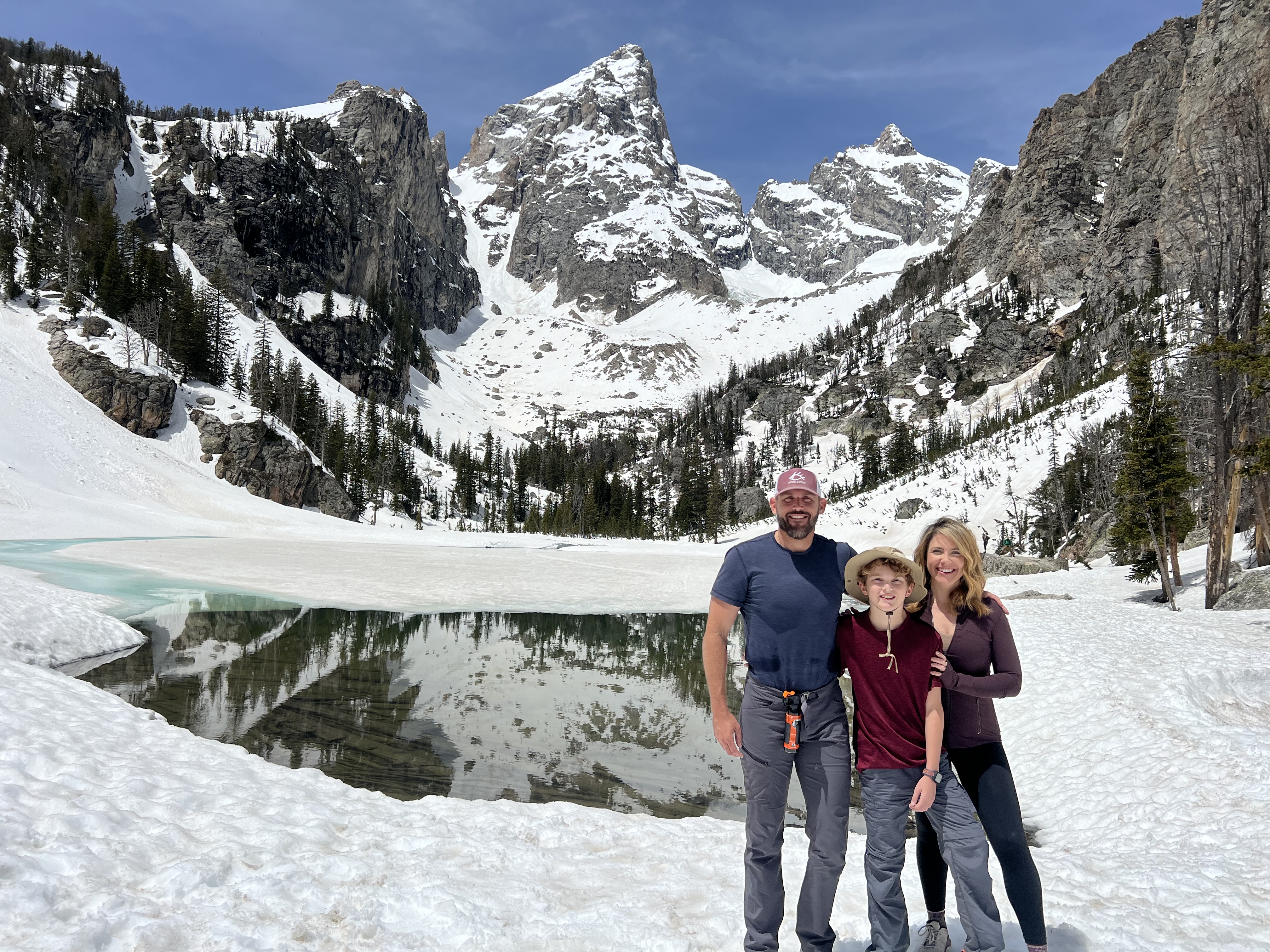 A snowy mountain lake hike together